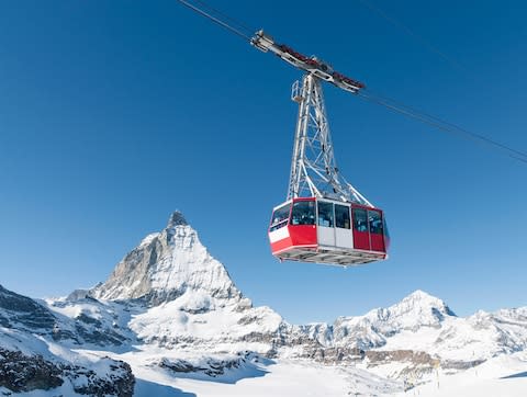 Zermatt would be an excellent choice and, since it is linked to Cervinia, it gives you the option of skiing down into Italy for lunch - Credit: GETTY