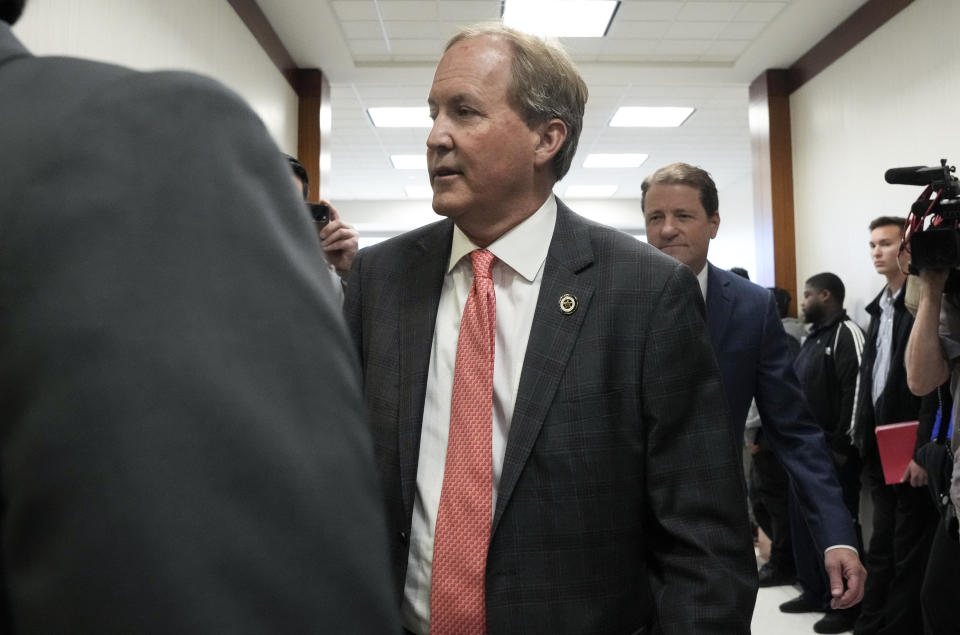 Texas Attorney General Ken Paxton appears at a pretrial hearing in his securities fraud case before state District Judge Andrea Beall, Tuesday, March 26, 2024 at Harris County Criminal Courts at Law in Houston. Prosecutors announced an agreement with Paxton that would ultimately dismiss securities fraud charges he has been facing for nearly a decade. (Yi-Chin Lee/Houston Chronicle via AP)