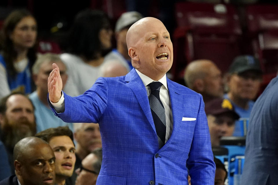 UCLA coach Mick Cronin shouts instructions to players during the first half of the team's NCAA college basketball game against Arizona State on Wednesday, Jan. 17, 2024, in Tempe, Ariz. (AP Photo/Ross D. Franklin)