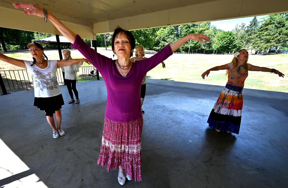 SHREWSBURY - Members of Silver Moon Gypsies practice their "gypsy fusion" style of dancing under a pavillion at Dean Park on Tuesday.