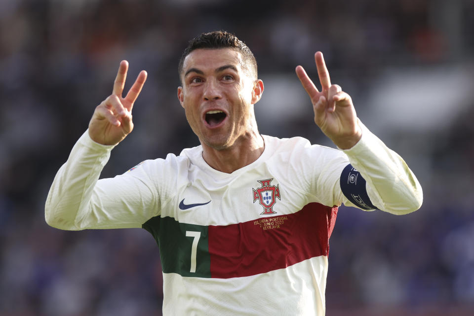 Portugal's Cristiano Ronaldo celebrates after scoring his side's first goal during the Euro 2024 group J qualifying soccer match between Iceland and Portugal in Reykjavík, Iceland, Tuesday, June 20, 2023. (AP Photo/Árni Torfason)