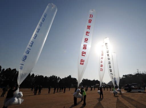 File photo shows defectors and conservative activists in South Korea releasing balloons towards North Korea carrying leaflets condemning leader Kim Jong Il. South Korean activists Thursday launched tens of thousands of anti-regime leaflets across the border into North Korea, defying threats from Pyongyang to open fire on launch sites