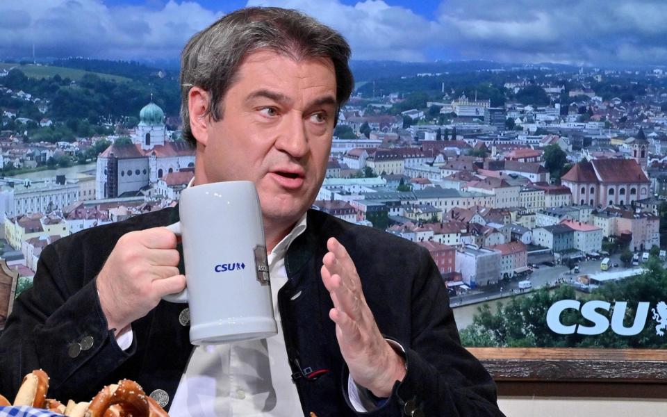 Bavaria's State Premier and leader of Germany's conservative Christian Social Union (CSU) party Markus Soeder drinks from a beer mug as he attends the CSU's political Ash Wednesday meeting on February 17, 2021 in Passau, southern Germany, amid the novel coronavirus / COVID-19 pandemic. - Due to the pandemic, the traditional meeting is taking place as an online event. (Photo by Peter Kneffel / POOL / AFP) (Photo by PETER KNEFFEL/POOL/AFP via Getty Images) - PETER KNEFFEL/AFP