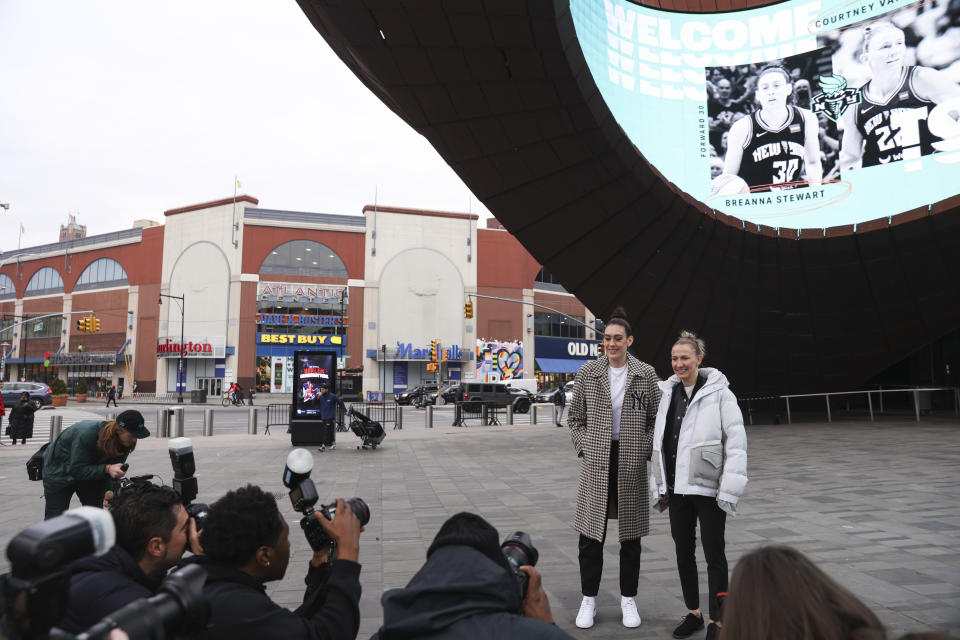 New York Liberty forward Breanna Stewart and guard Courtney Vandersloot pose in front of Barclays Center before a WNBA basketball news conference, Thursday, Feb. 9, 2023, in New York. (AP Photo/Jessie Alcheh)