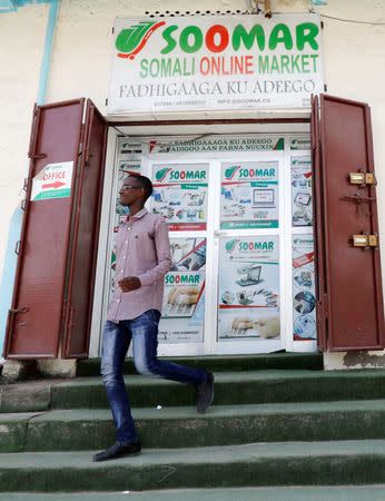 A customer walks out of the Somali Online Market (SOOMAR) offices at Maka Al Mukarama street in Mogadishu, Somalia, October 17, 2018 REUTERS/Feisal Omar