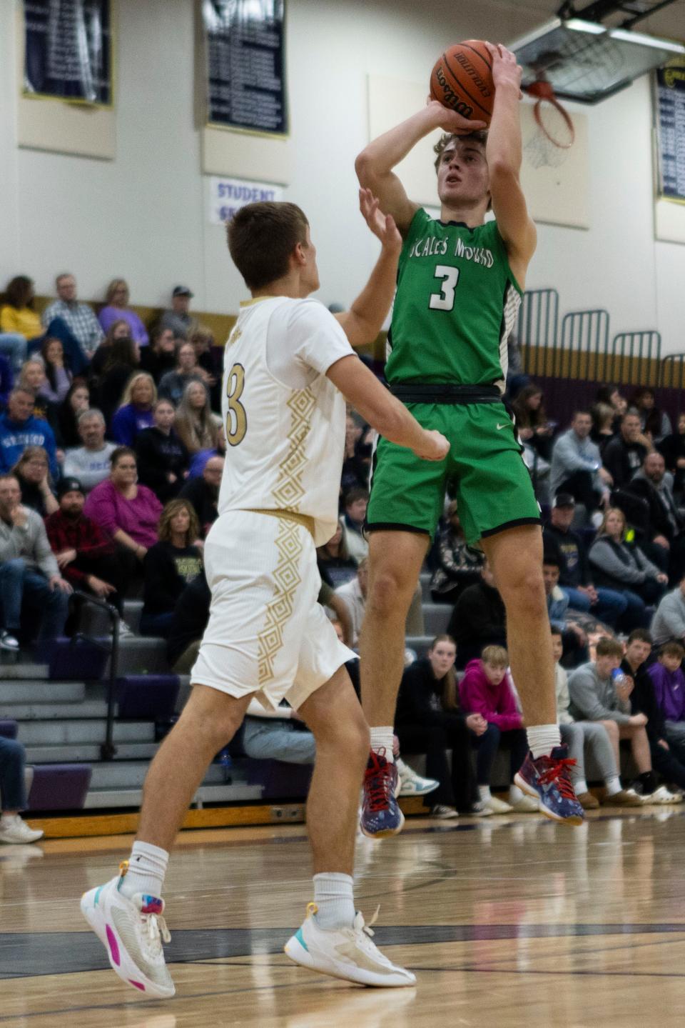 Scales Mound's Thomas Hereau (3) shoots the ball while being guarded by Pecatonica's Cooper Hoffman (3) on Dec. 6, 2023 at Pecatonica High School.