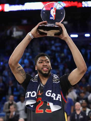 <p>Ronald Martinez/Getty</p> Anthony Davis with the 2017 NBA All-Star Game MVP trophy after the 2017 NBA All-Star Game at Smoothie King Center on February 19, 2017 in New Orleans, Louisiana.