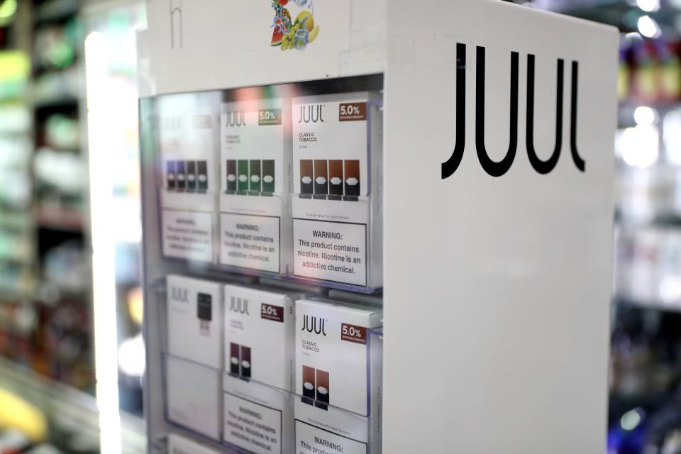Electronic cigarette company Juul Labs agreed to pay $438.5 million and stop marketing its vaping products to children to settle a two-year investigation by Ohio and 32 other states. Justin Sullivan/Getty Images