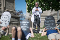 <p>Robert Stone, a local doctor and member of Physicians for a National Health Program, oversees a handful of protesters as local concerned citizens gather to protest the current health care bill being considered in the Senate with a “Die-in” at the Monroe County Courthouse in Bloomington, Ind. Monday, June 26, 2017. (Photo: Chris Howell/The Herald-Times via AP) </p>
