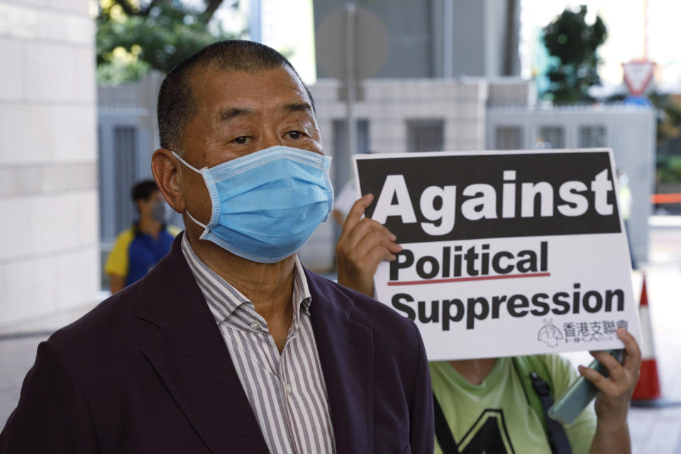 Hong Kong media tycoon Jimmy Lai, founder of the local newspaper Apple Daily, arrives a district court in Hong Kong, Thursday, July 30, 2020. Activists including Lai who organized the June 4th Tiananmen massacre memorial this year, which was banned by police because of anti-virus social distancing reasons, appeared in a Hong Kong court on Monday on charges of inciting others to participate in an unlawful assembly. (AP Photo/Kin Cheung)