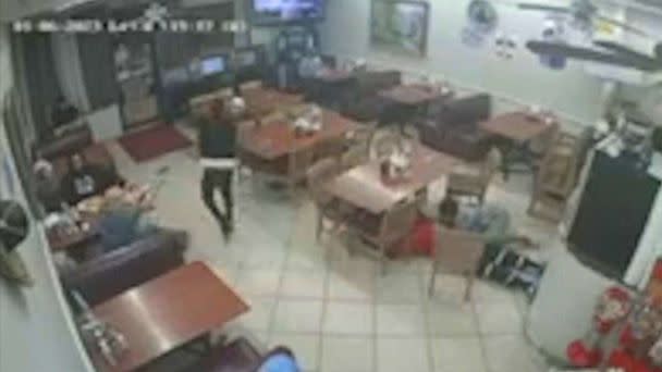 PHOTO: Security video from inside the The Ranchito #4 taqueria in southwest Houston shows a 46-year-old diner fatally shooting an alleged masked robber on Jan. 5, 2023. (KTRK)