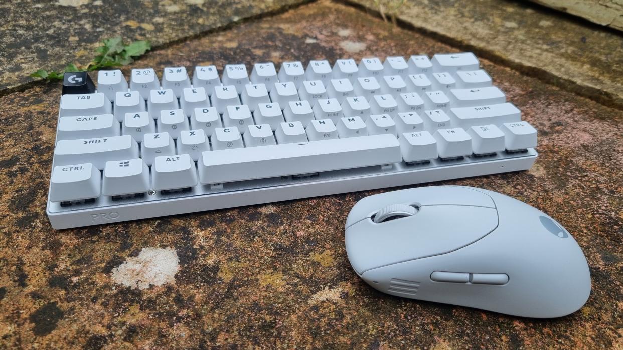  Two esports peripherals, a Logitech PRO 60X esports keyboard and an Alienware Pro mouse, outside on a lovely paving slab. 