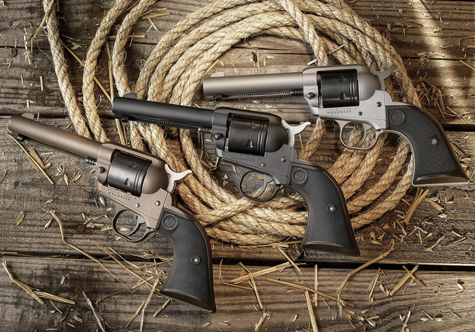 Three revolvers lying on a coil of rope