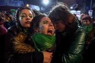 <p>Activists in favour of the legalization of abortion comfort each other outside the National Congress in Buenos Aires, on Aug. 9, 2018 after senators rejected the bill to legalize the abortion. (Photo: Eitan Abramovich/AFP/Getty Images) </p>
