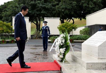 Japanese Prime Minister Shinzo Abe presents a wreath at the National Memorial Cemetery of the Pacific at Punchbowl in Honolulu, Hawaii, U.S. December26, 2016. REUTERS/Hugh Gentry
