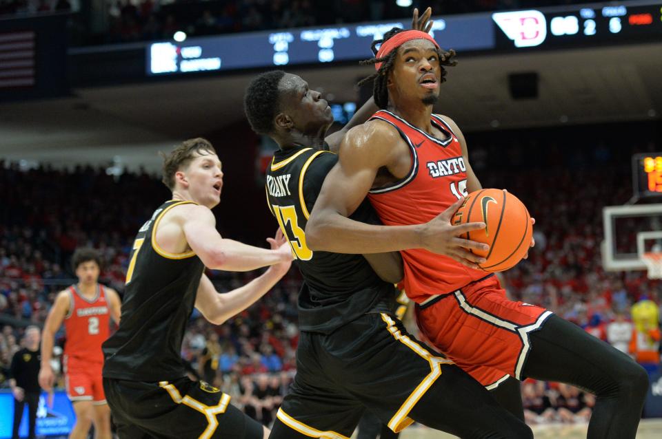 Dayton Flyers forward DaRon Holmes II (15) battles against Virginia Commonwealth Rams forward Kuany Kuany (13) during the second half of the game at University of Dayton Arena on March 8, 2024.