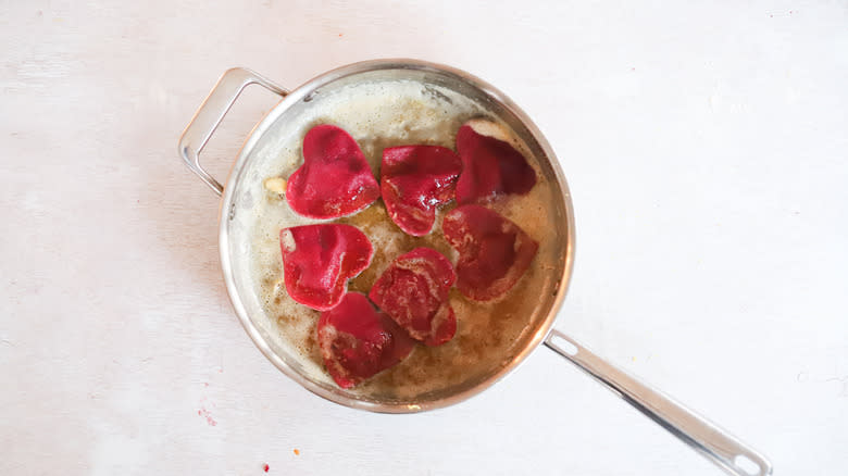 beet ravioli in sauce