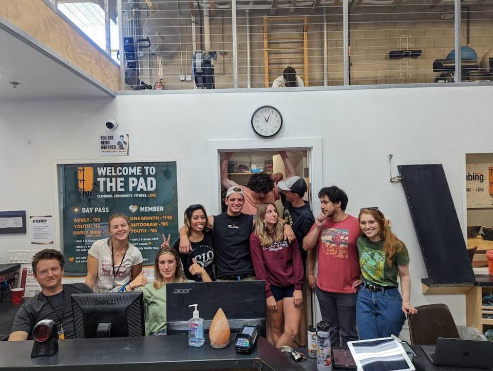 The Pad Climbing gym staff pose for a photo. Gym owner Kristin Tara Horowitz said most of her staff live in subpar living arrangements or are unable to afford housing in the same city as their jobs.