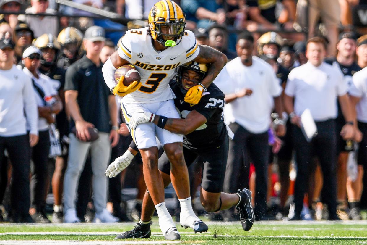 Sep 30, 2023; Nashville, Tennessee, USA; Vanderbilt Commodores defensive back Jaylen Mahoney (23) tackles Missouri Tigers wide receiver Luther Burden III (3) for a loss during the first half at FirstBank Stadium. Mandatory Credit: Steve Roberts-USA TODAY Sports