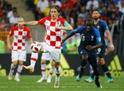 Croatia's Luka Modric in action with France's N'Golo Kante. REUTERS/Kai Pfaffenbach