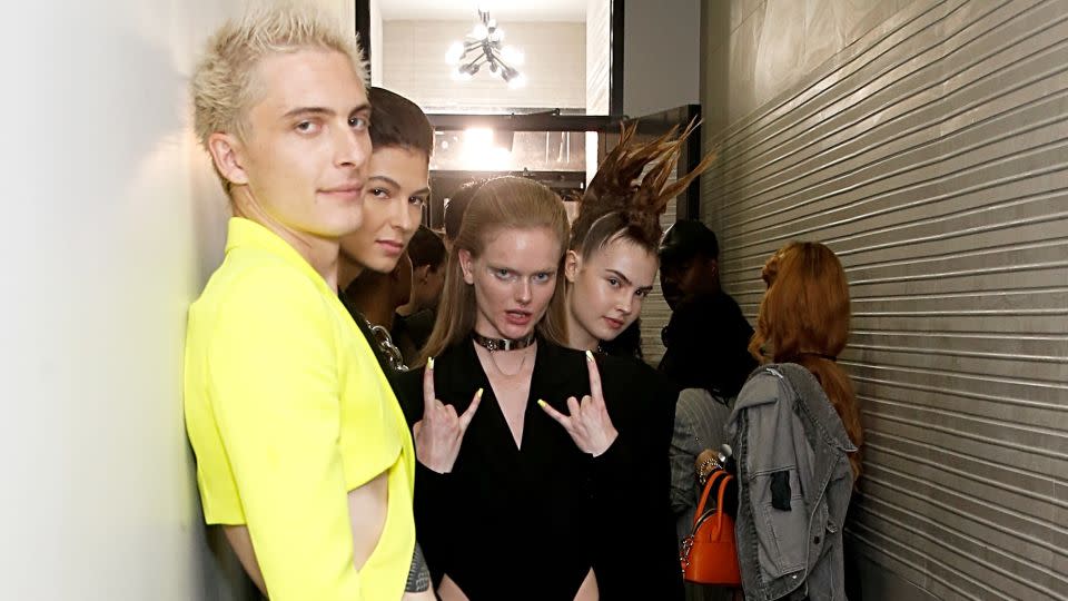 Models in the lobby of Delvey's East Village apartment building before beginning their ascent to its rooftop. - Dominik Bindl/Getty Images