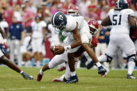 Georgia Southern quarterback Justin Tomlin (17) is tackled by Arkansas Greg Brooks Jr. (9) during the first half of an NCAA college football game Saturday, Sept. 18, 2021, in Fayetteville, Ark. (AP Photo/Michael Woods)