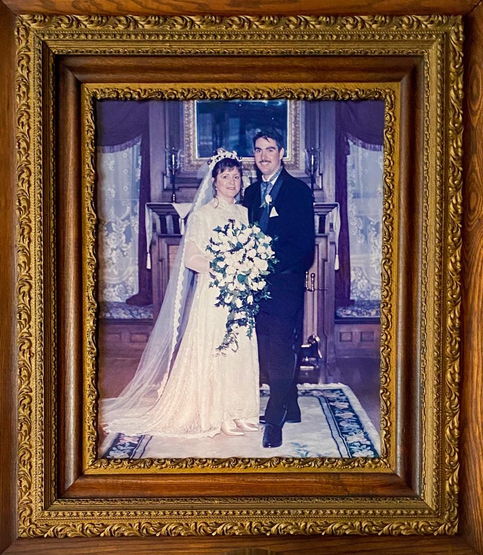 The wedding portrait of Connie and Jim Soule hangs above the spot where it was photographed, in their Rock Street home.