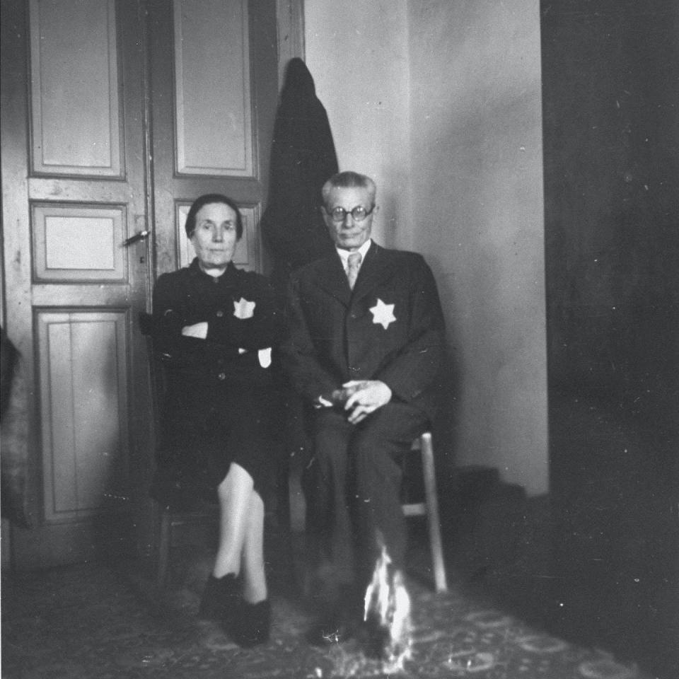 Greek Jewish couple wearing the yellow star poses in their apartment in Salonica, 1942 or 1943. <a href="https://collections.ushmm.org/search/catalog/pa1050685" rel="nofollow noopener" target="_blank" data-ylk="slk:U.S. Holocaust Memorial Museum;elm:context_link;itc:0;sec:content-canvas" class="link ">U.S. Holocaust Memorial Museum</a>