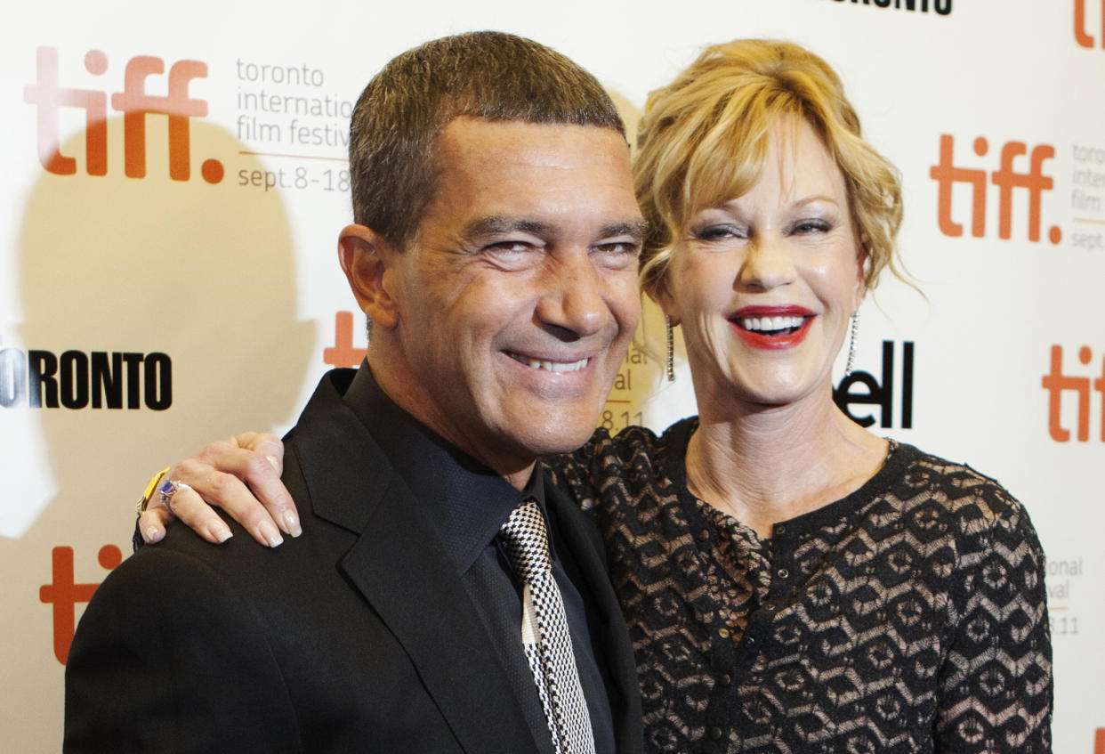Cast member Antonio Banderas and his wife actress Melanie Griffith arrive on the red carpet for the film "The Skin I Live In" during the 36th Toronto International Film Festival (TIFF) September 11, 2011. REUTERS/Mark Blinch (CANADA - Tags: ENTERTAINMENT)