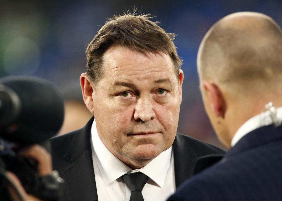 In this Oct. 27, 2018, photo, New Zealand All Blacks coach Steve Hansen, center, speaks to the media after their Bledisloe Cup rugby test against Australia at the Nissan Stadium in Yokohama, Japan. Hansen has selected eight new caps in his squad for the match at Tokyo on Saturday, Nov. 3 ; the most rookies in one All Blacks squad since 1986 when the so-called "Baby Blacks" beat France while most leading players were suspended for their part in a rebel tour to South Africa. (AP Photo/Shuji Kajiyama)