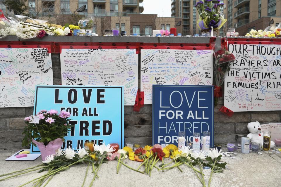 <p>Flowers and signs fill a memorial along Yonge Street Tuesday, April 24, 2018, in Toronto, the day after a driver drove a van down sidewalks, striking and killing numerous pedestrians in his path. (Photo: Galit Rodan/The Canadian Press via AP) </p>