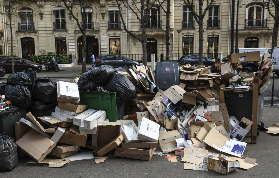 FILE - Uncollected garbage is piled up on a street in Paris, March 20, 2023, as strikes continue with uncollected garbage piling higher by the day. (AP Photo/Aurelien Morissard, File)