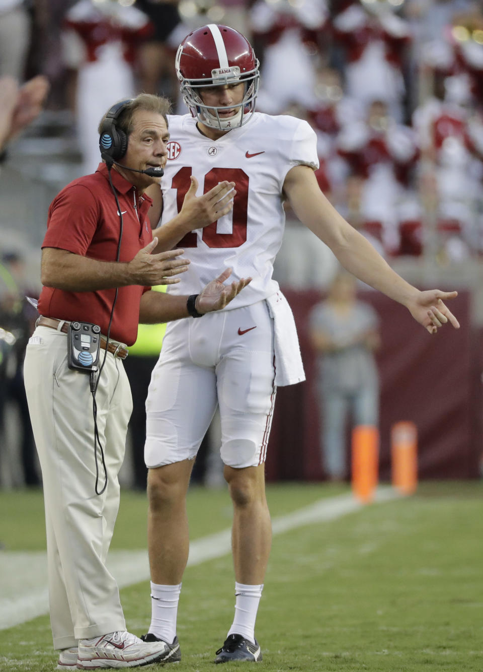 Alabama coach Nick Saban, left, talks with punter JK Scott during the first quarter of an NCAA college football game Saturday, Oct. 7, 2017, in College Station, Texas. (AP Photo/David J. Phillip)