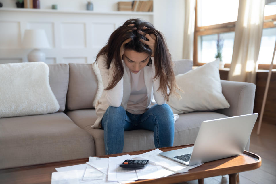 woman stressing out over her bills