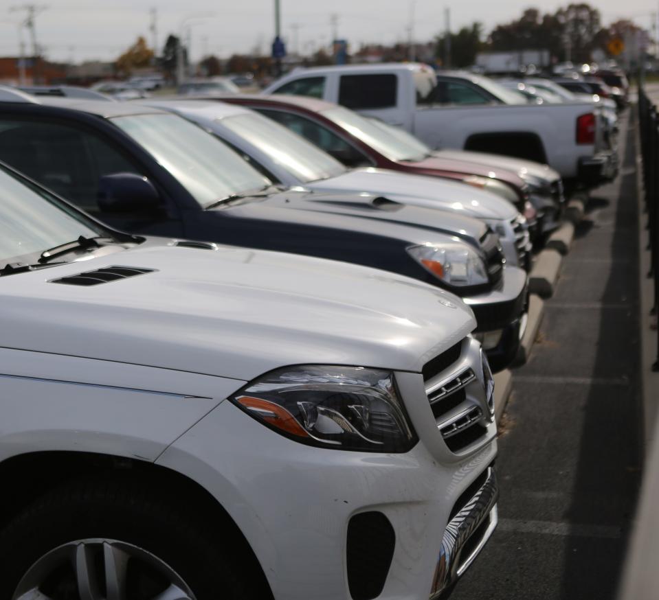 Cars are parked in the parking lot of the Wilmington Airport in North Carolina.