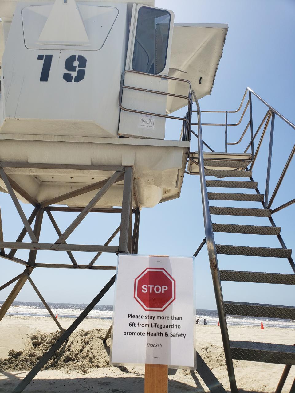 A sign outside of a lifeguard tower on a beach in San Diego, Calif. | B. Chris Brewster