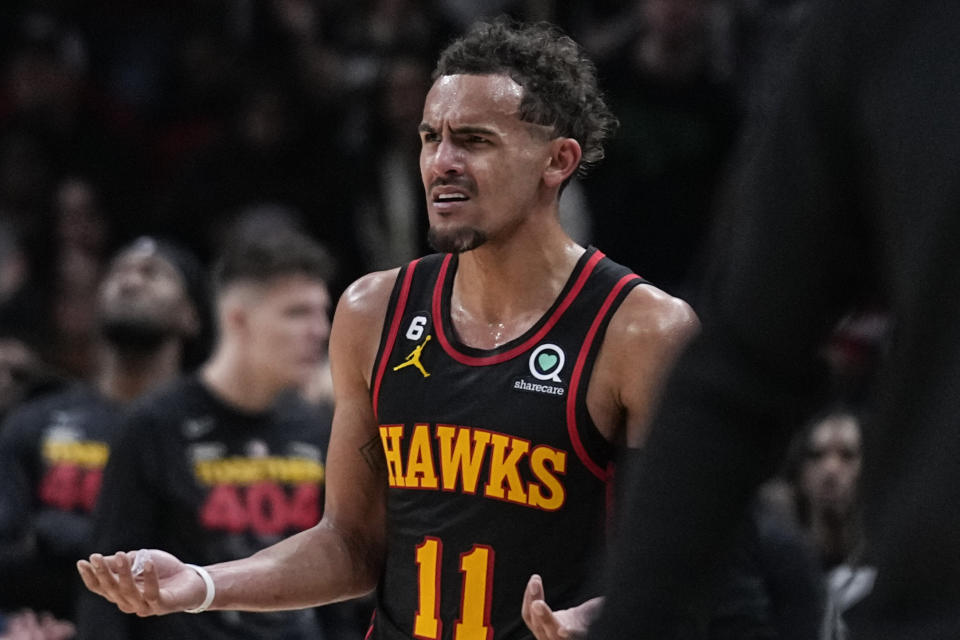 Atlanta Hawks guard Trae Young (11) reacts after a fouls was called during the first half of Game 4 of a first-round NBA basketball playoff series against the Boston Celtics Sunday, April 23, 2023, in Atlanta. (AP Photo/Brynn Anderson)