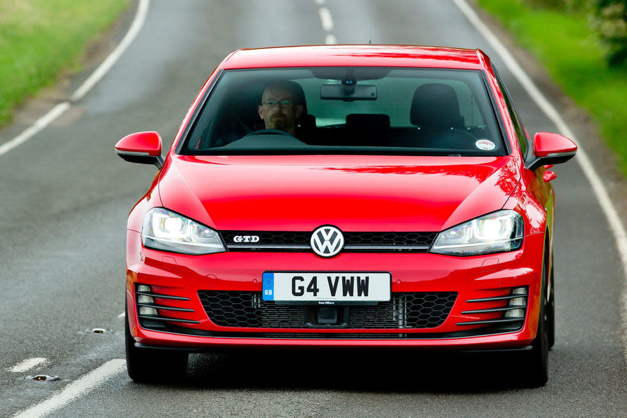 Red Mk7 Volkswagen Golf GTD driving – front tracking