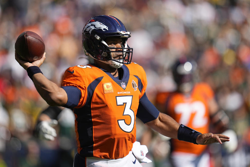 Denver Broncos quarterback Russell Wilson (3) passes against the Green Bay Packers during the first half of an NFL football game in Denver, Sunday, Oct. 22, 2023. (AP Photo/Jack Dempsey)