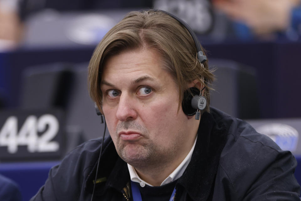 Germany's Maximilian Krah, of the far-right Alternative, grimaces during a session at the European Parliament, Tuesday, April 23, 2024 in Strasbourg, eastern France. A man who works for the prominent German far-right lawmaker in the European Parliament has been arrested on suspicion of spying for China, authorities said Tuesday. (AP Photo/Jean-Francois Badias)