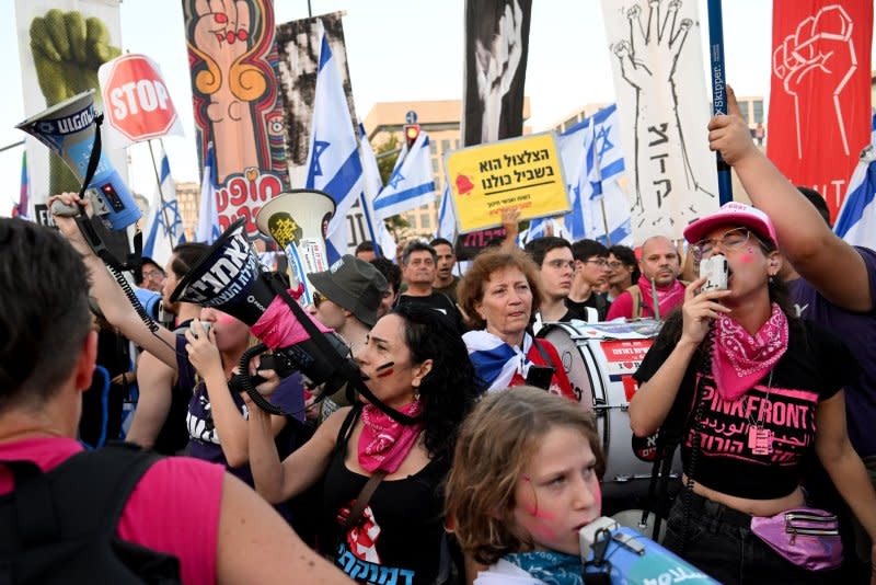 Thousands of Israeli protesters gather Monday outside of the Supreme Court in Jerusalem, where the 15 judge bench will convene Tuesday for the first time in history to hear appeals of a law, passed by Prime Minister Benjamin Netanyahu’s coalition, preventing Israeli courts from weighing in on the reasonableness of government and ministerial decisions. Photo by Debbie Hill/UPI