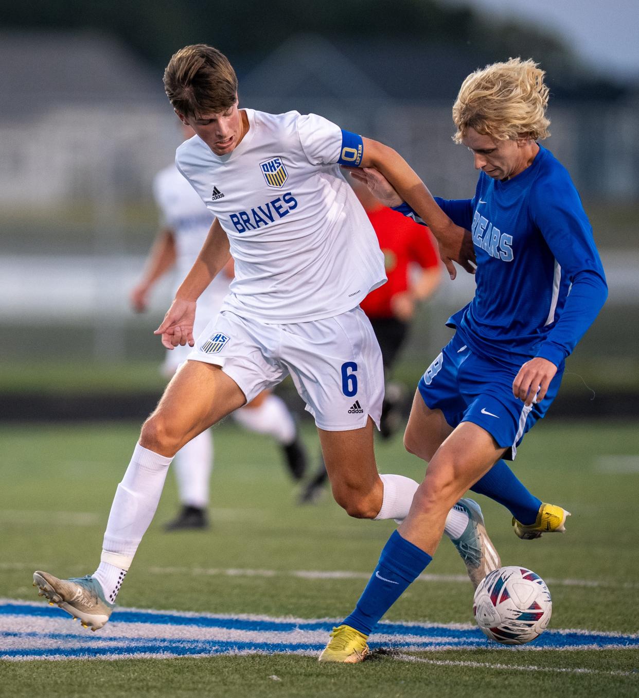 Olentangy's Noah Schmidt, left, fights for the ball with Olentangy Berlin's Josh Nietfeld.