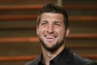 Former NFL player Tim Tebow arrives at the 2014 Vanity Fair Oscars Party in West Hollywood, California March 2, 2014. REUTERS/Danny Moloshok