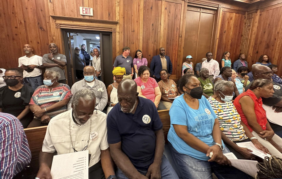 FILE - Residents, landowners and supporters of the Hogg Hummock community on Sapelo Island fill a courtroom, Sept. 12, 2023, in Darien, Ga. Two weeks after local officials weakened restrictions that for decades protected the tiny Georgia island community populated by the descendants of enslaved people, its Black residents hope to force a vote that would give them a chance to override the zoning changes at the ballot box. Hogg Hummock residents and their supporters launched a petition drive Tuesday, Sept. 26, aimed at forcing a referendum on the zoning changes. (AP Photo/Russ Bynum, File)