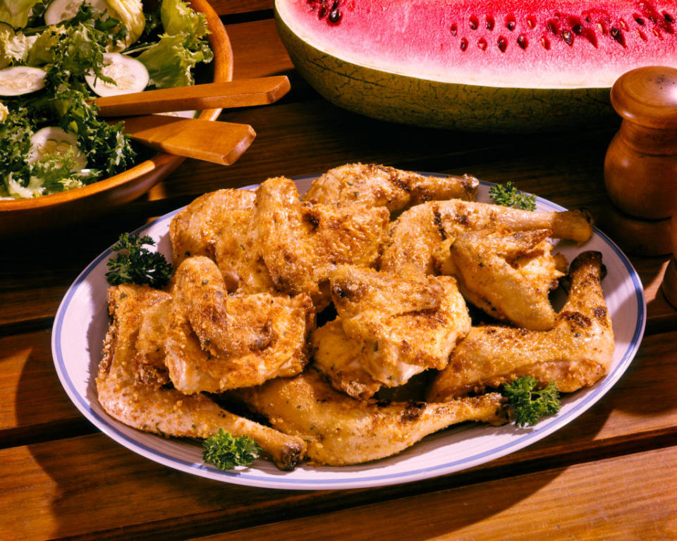 plate full of crispy fried chicken wings