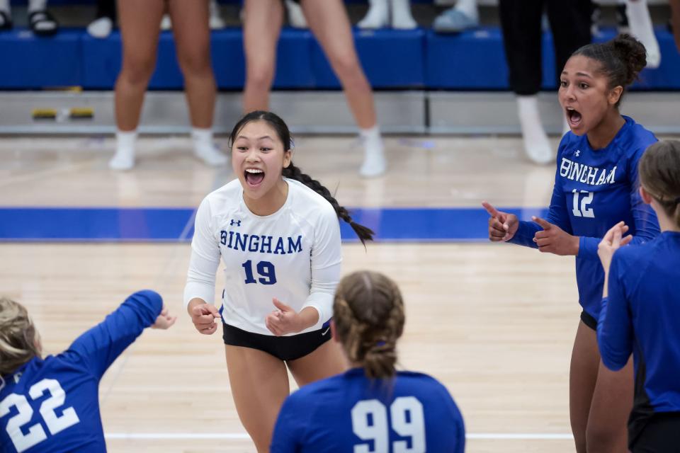 Bingham’s Jessica Truong, second from left, and Levani Key-Powell, second from right, and teammates celebrate a point over Mountain Ridge in a volleyball match in South Jordan on Tuesday, Sept. 12, 2023. | Spenser Heaps, Deseret News