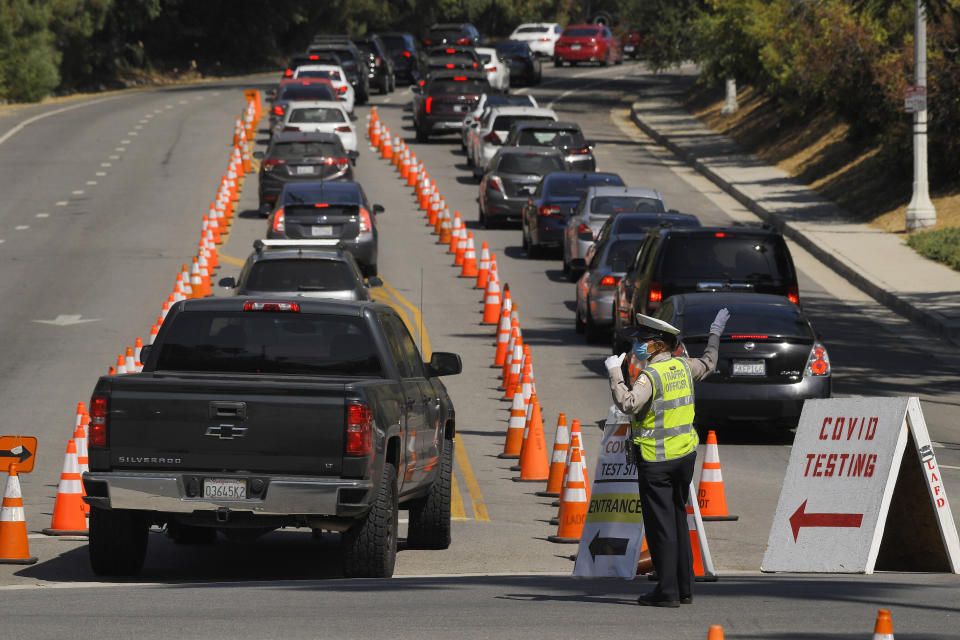 People wait in line for coronavirus testing at Dodger Stadium, July 14, in Los Angeles. (AP Photo/Mark J. Terrill) (Photo: ASSOCIATED PRESS)