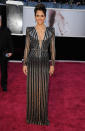 <b>Halle Berry</b><br> <b>Grade: A</b><br> As usual, Halle Berry brought the va-va-voom in this plunging metallic Versace creation. The Oscar winner ("Monster's Ball") said on the red carpet that she wanted to dress as a Bond girl for the Academy Awards, and she certainly succeeded!