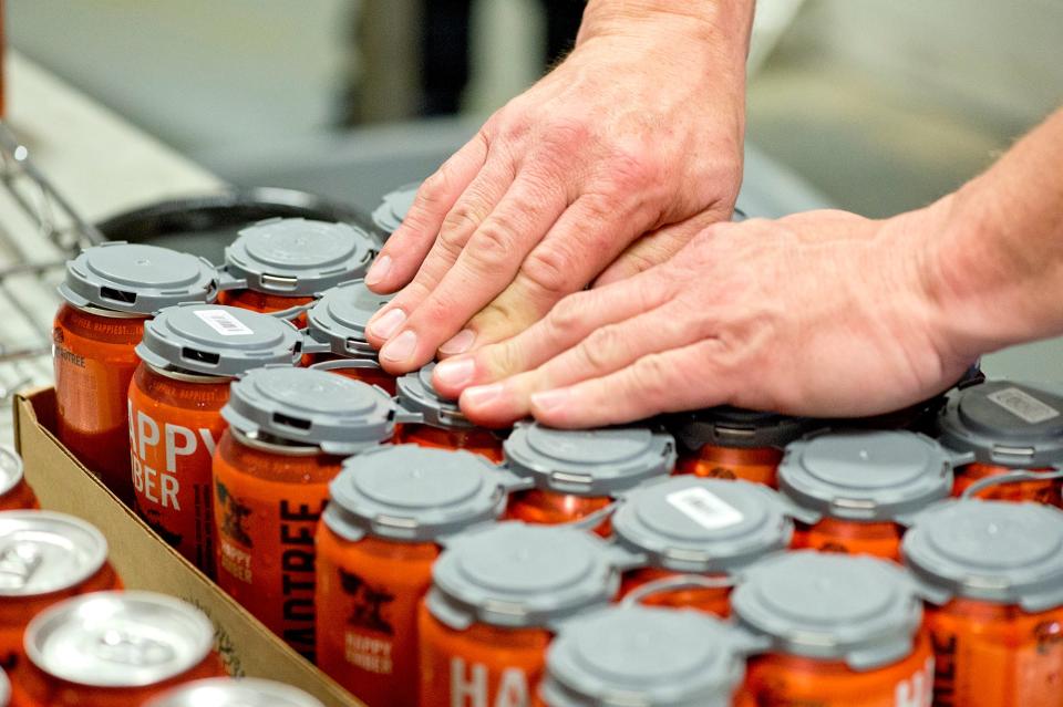 Freshly canned Happy Amber beer.