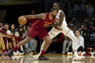 Cleveland Cavaliers forward Marcus Morris Sr. (24) dribbles under pressure from Los Angeles Lakers forward Taurean Prince (12) during the first half of an NBA basketball game Saturday, April 6, 2024, in Los Angeles. (AP Photo/William Liang)